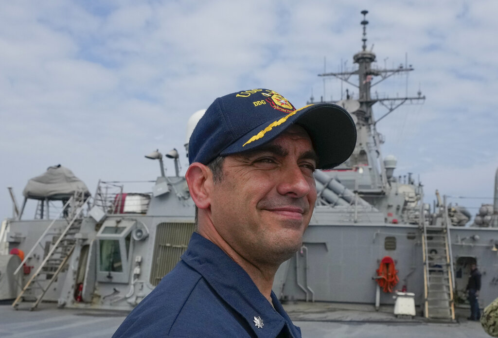 John D. John, commanding officer of guided-missile destroyer USS Ross, smiles during Sea Breeze 2021 exercises, in the Black Sea