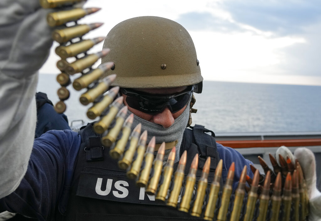 Navy sailor of destroyer USS Ross Nicholas Schwab from Breinero, Minnesota, prepares his machine gun during Sea Breeze 2021 maneuvers, in the Black Sea