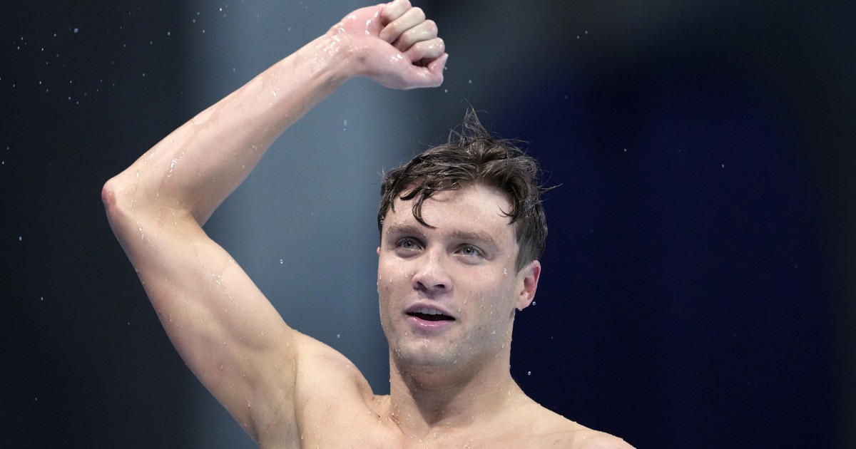 Young man with arm up