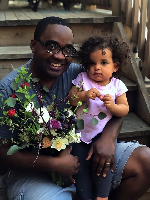 Quilen Blackwell and his daughter with flowers