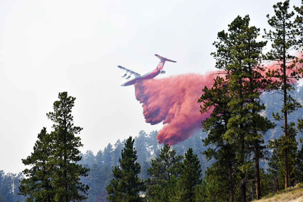 Plane drops retardant on Richard Spring fire in Montana