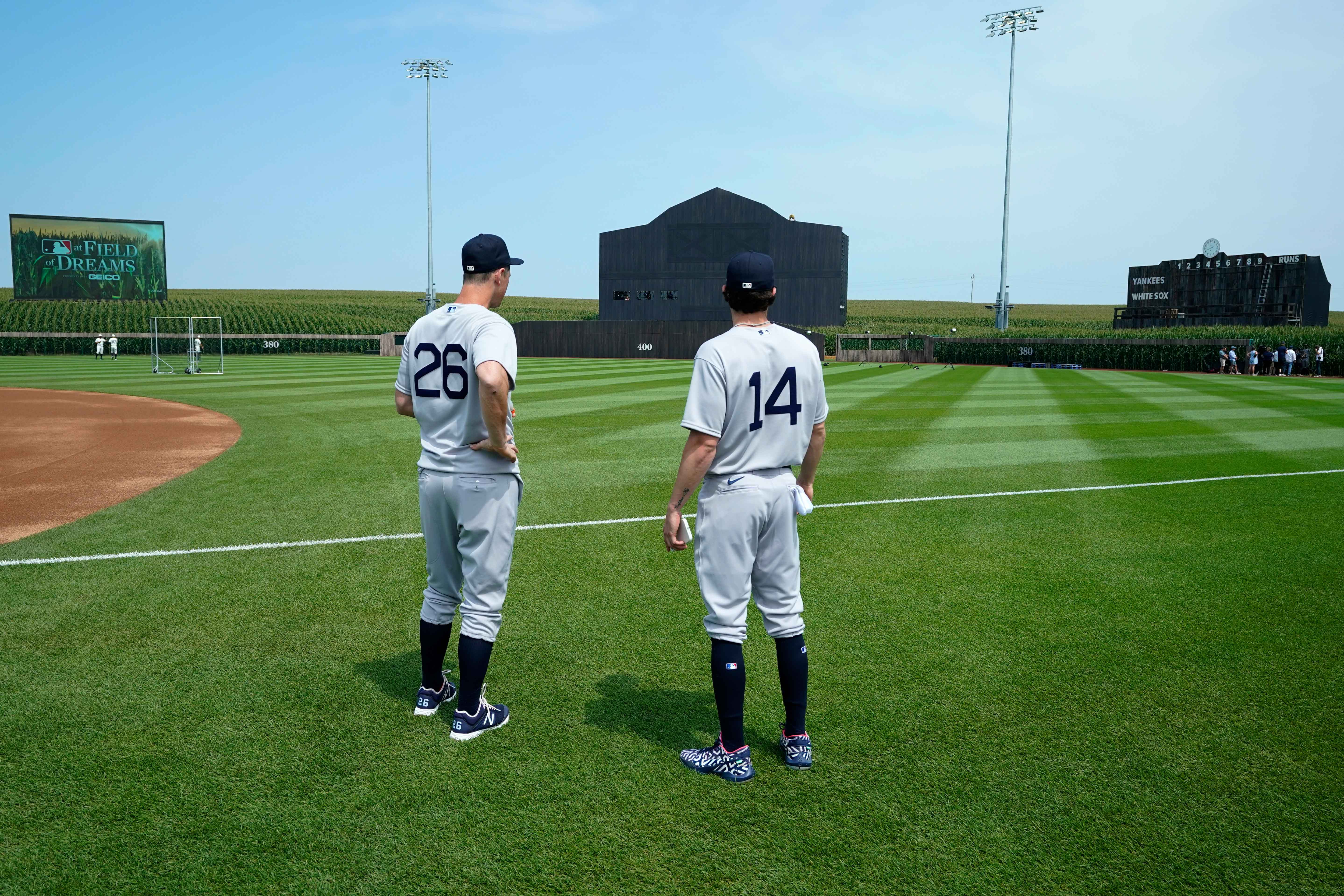 players stand on the field before "Field Of Dreams" game