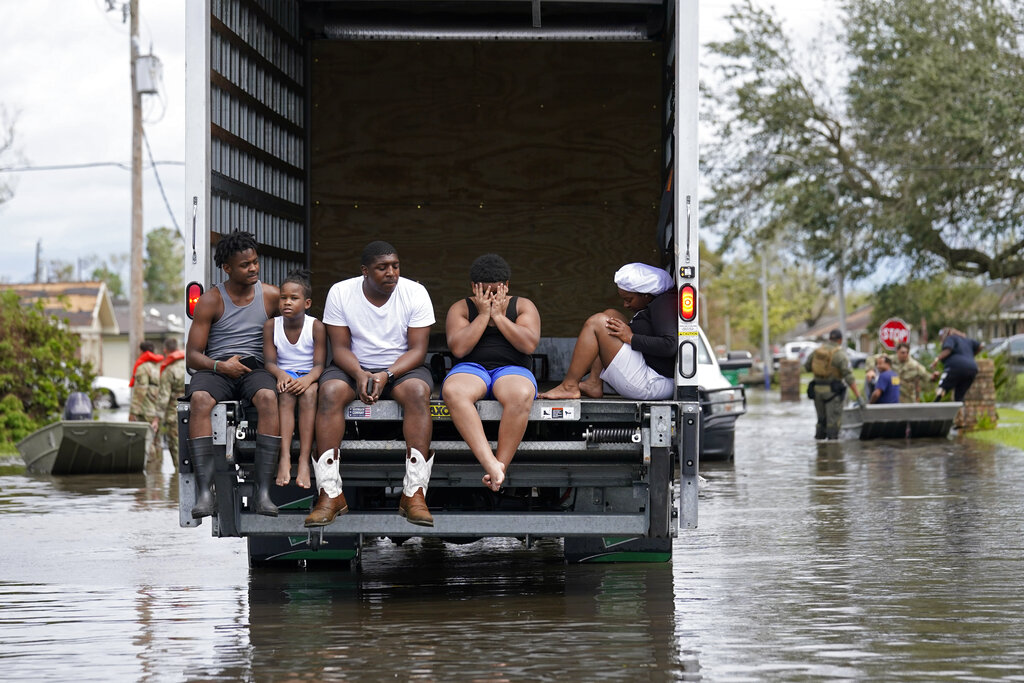 People are evacuated from floodwaters in the aftermath of Hurricane Ida in LaPlace, La.