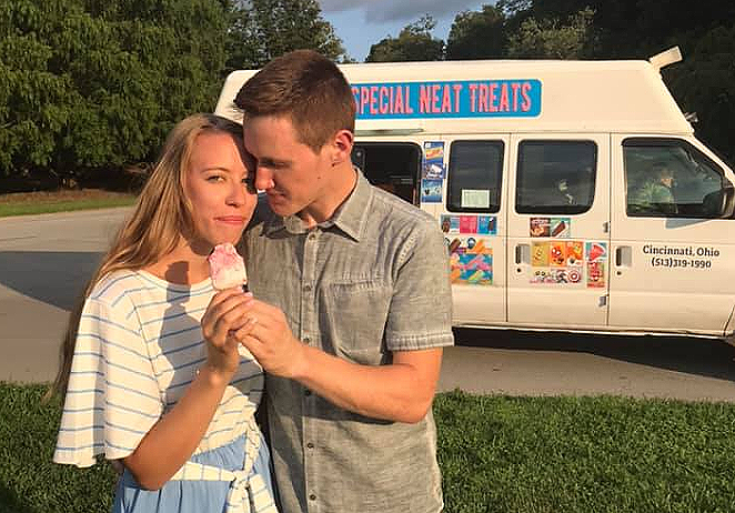 Couple that just got engaged enjoys an ice cream treat from Special Neat Treats Ice Cream Truck