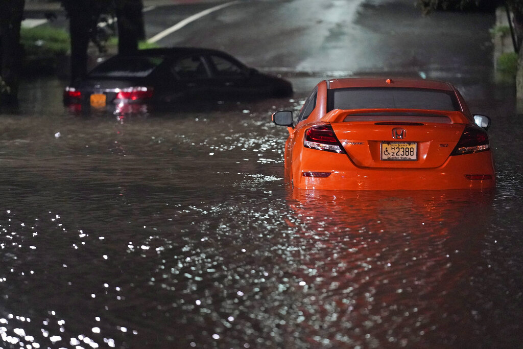 Abandoned cars sit in high water
