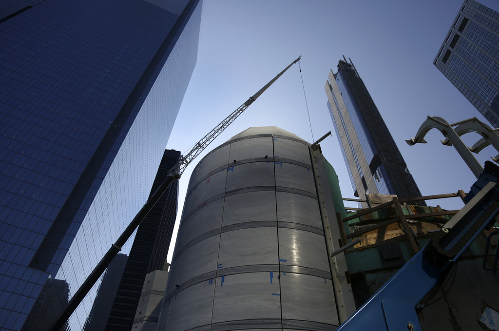 A crane lifts sections of marble onto the dome of St. Nicholas Greek Orthodox Church and National Shrine 