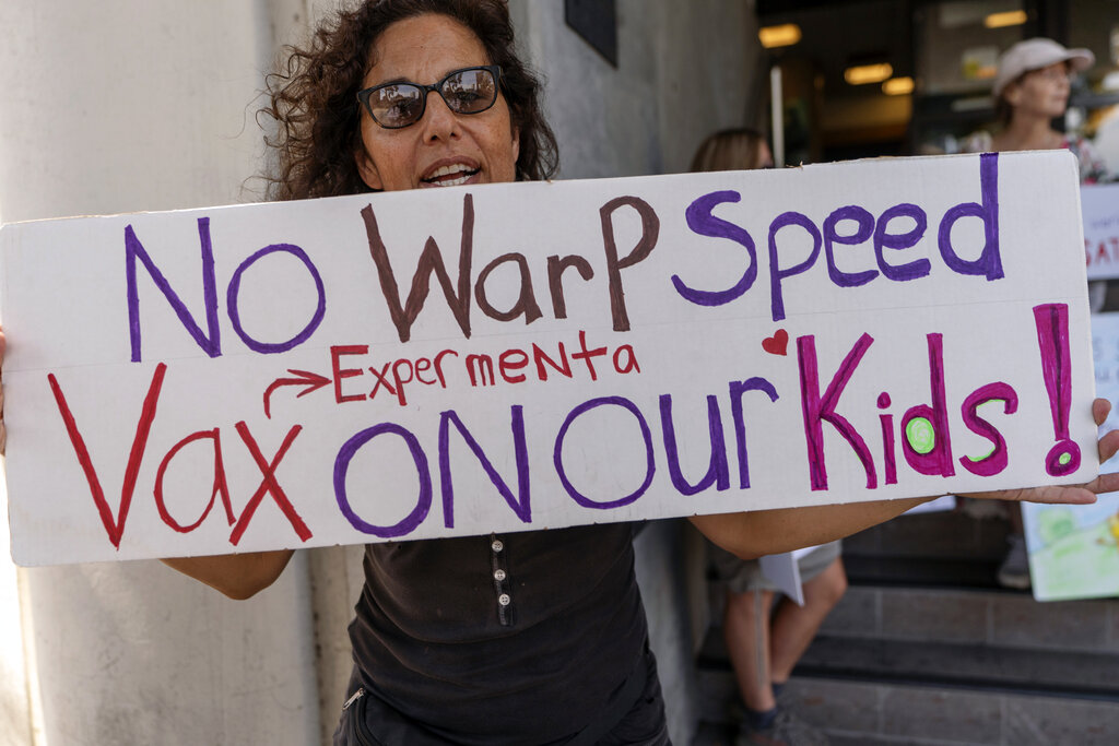 Nancy, the mother of a teenager student joins anti-vaccine protestors outside the Los Angeles Unified School District administrative offices in Los Angeles