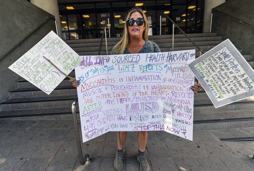 Bryna Makowka, who has a teenage son joins anti-vaccine protestors outside the Los Angeles Unified School District administrative offices in Los Angeles 