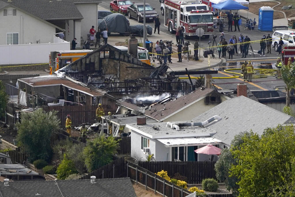 Emergency crews work a the scene of the plane crash