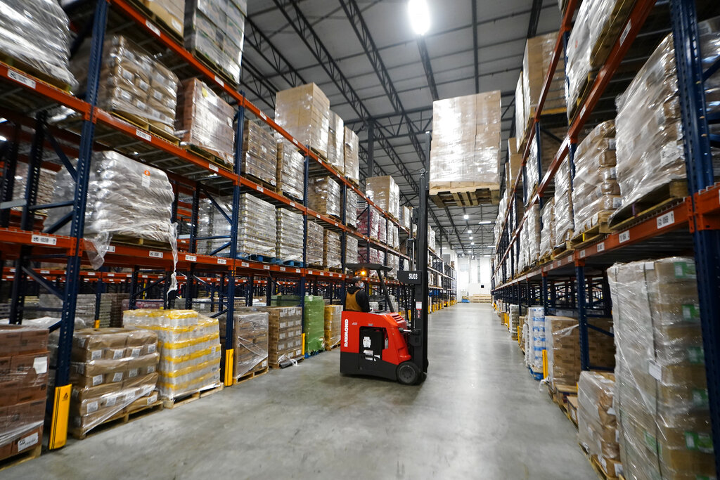Worker loading food onto forklift at Atlanta Food Bank