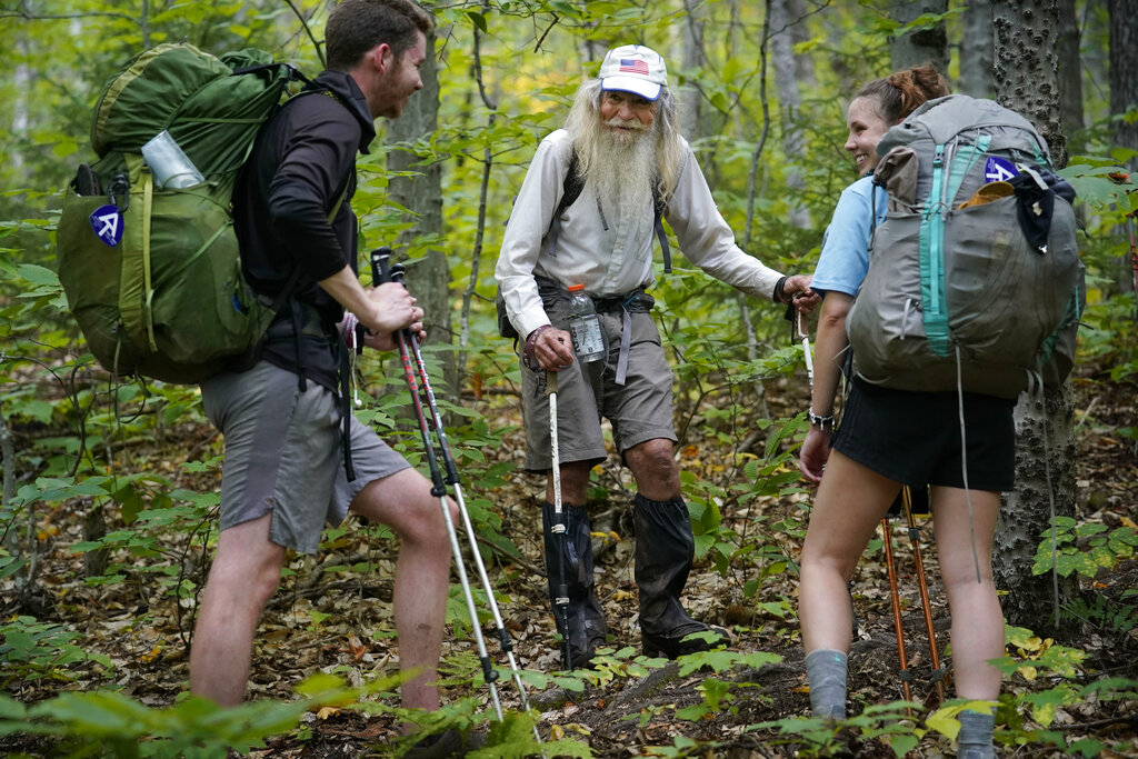 M.J. Eberhart, 83, center, shares trail information with a pair of thru-hikers on the Appalachian Trail