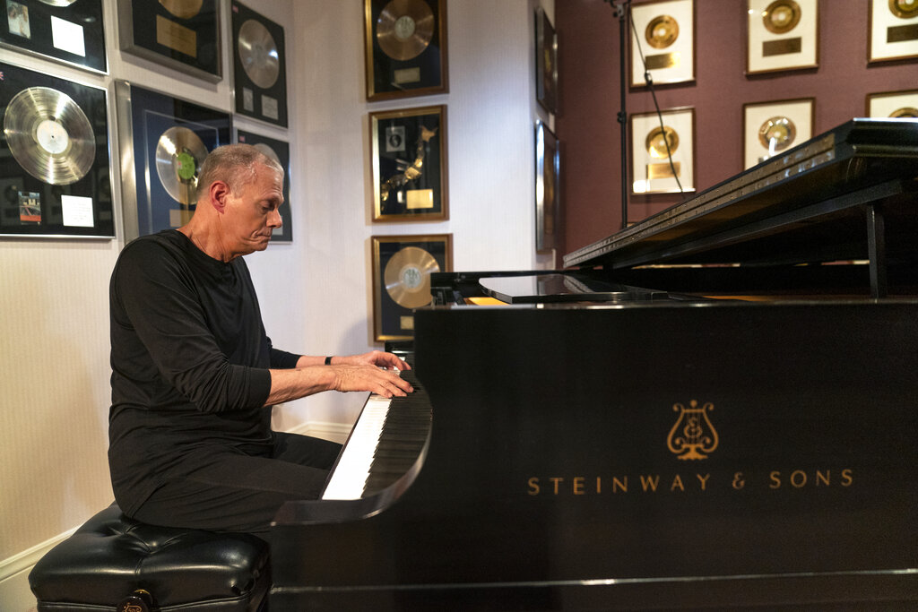 Richard Carpenter plays the piano at his home studio in Thousand Oaks, Calif.