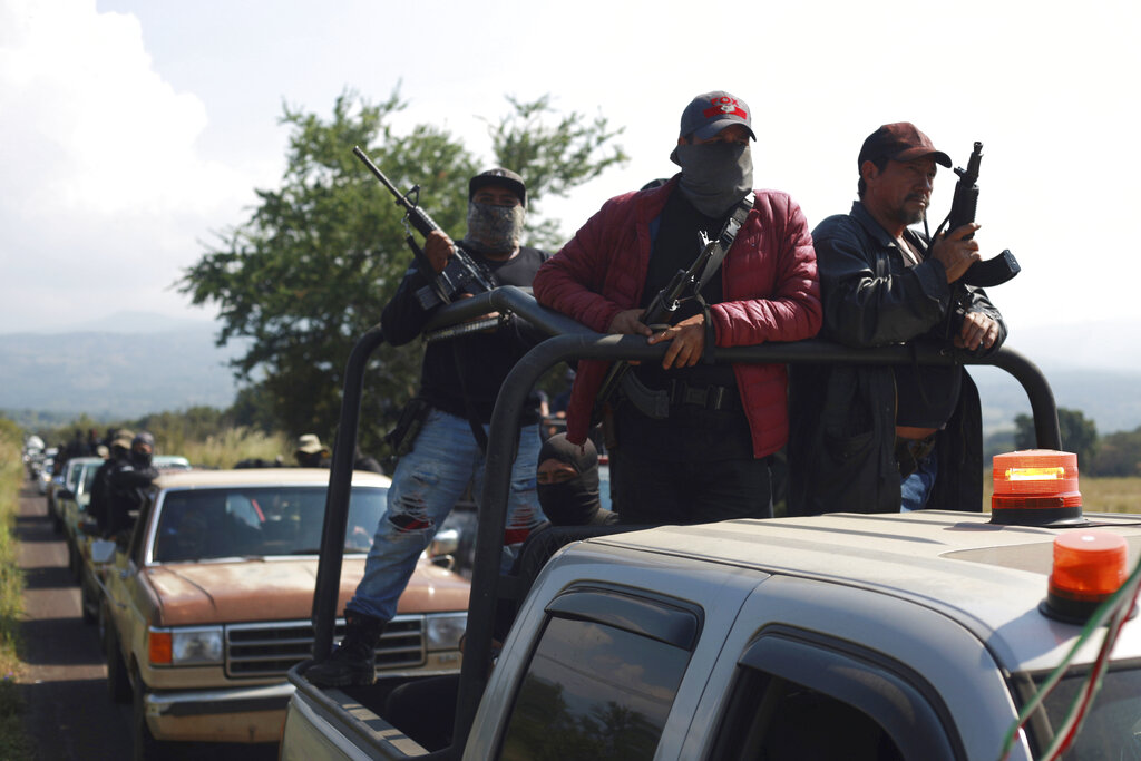 Members of the so-called self-defense group known as United Towns or Pueblos Unidos, gather for a rally in Nuevo Urecho, in the Mexican western state of Michoacan