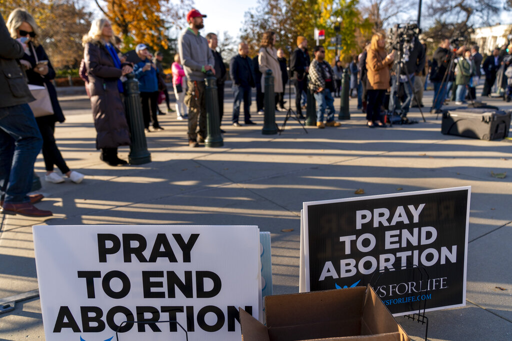 People listen during a pro-life rally outside of the Supreme Court in Washington,
