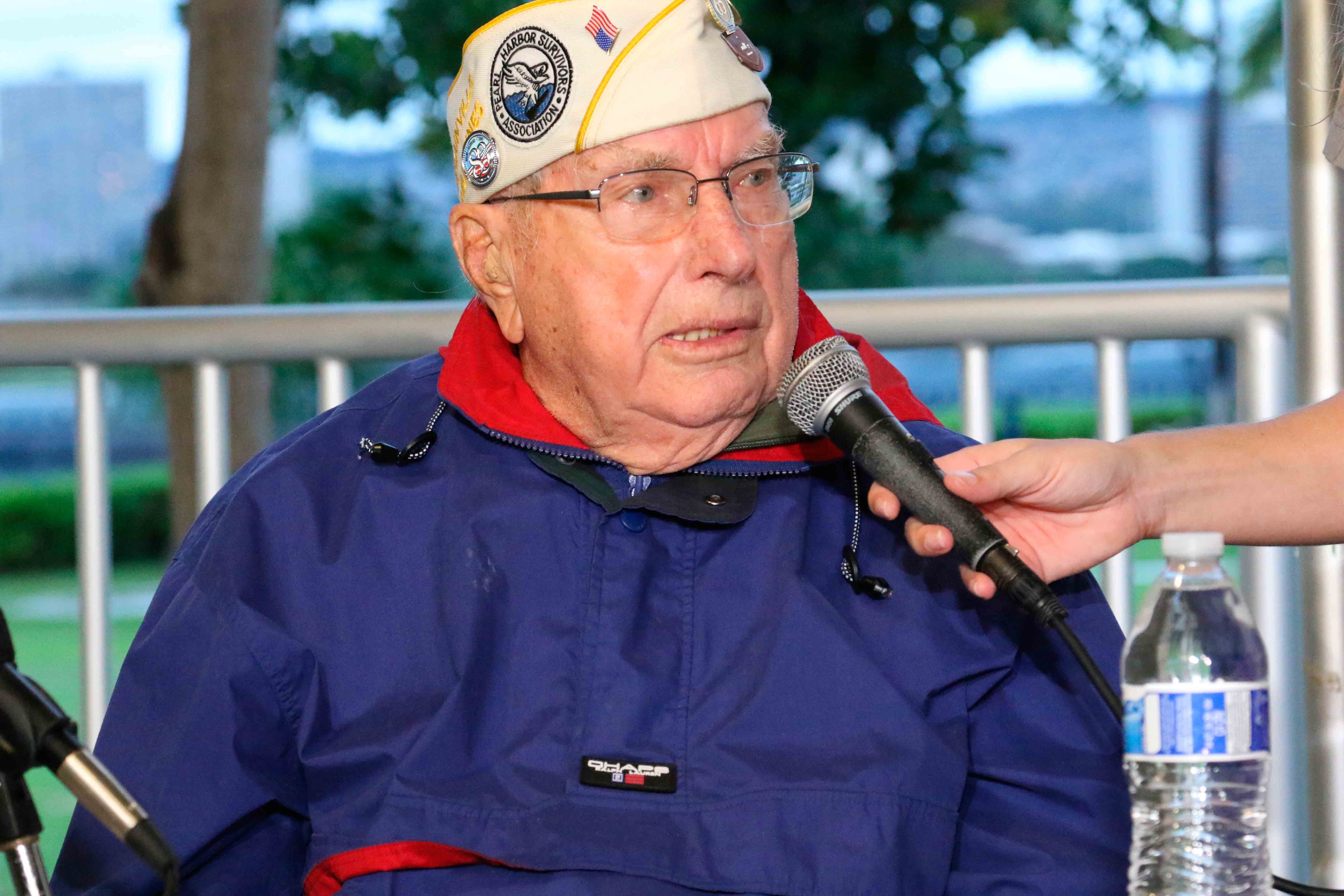 Pearl Harbor survivor Herb Elfring speaks at a news conference in Pearl Harbor, Hawaii on Sunday, Dec. 5, 2021.