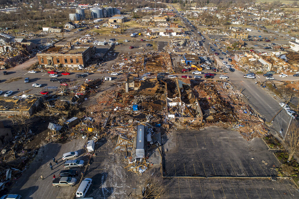 In this photo taken by a drone, buildings are demolished in downtown Mayfield, Ky.