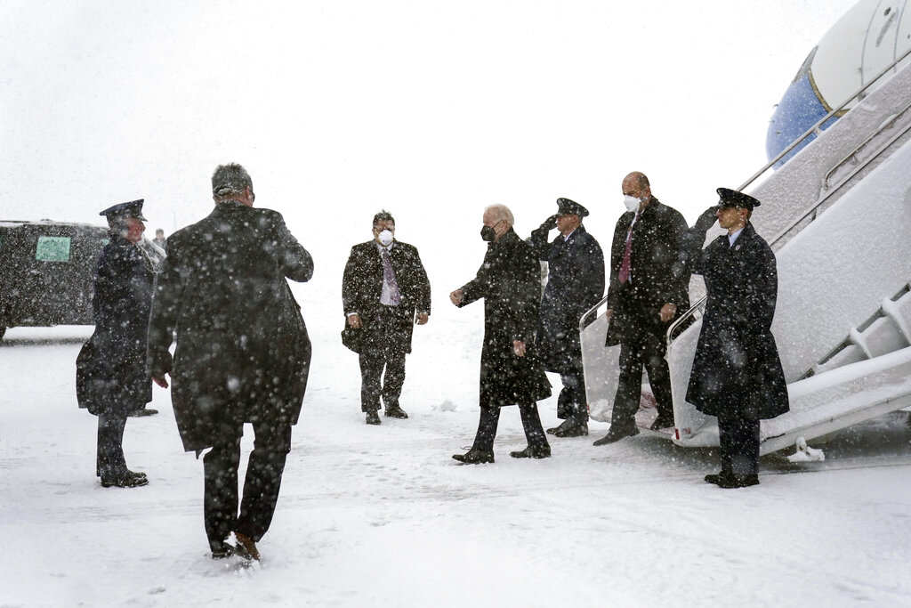 President Joe Biden arrives on Air Force One during winter snowstorm at Andrews Air Force Base, Md.