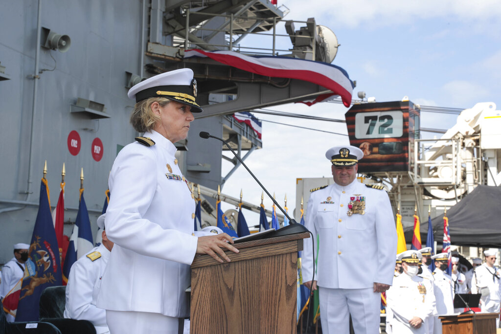 U.S. Navy, Capt. Amy Bauernschmidt, left, incoming commanding officer of the aircraft carrier USS Abraham Lincoln (CVN 72)