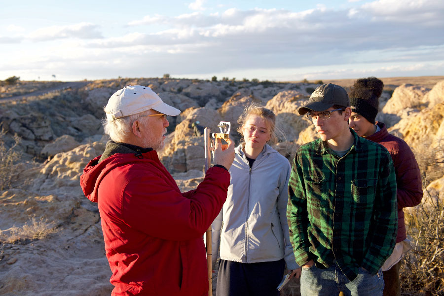 Professor Whitmore instructs students during their backpacking trip