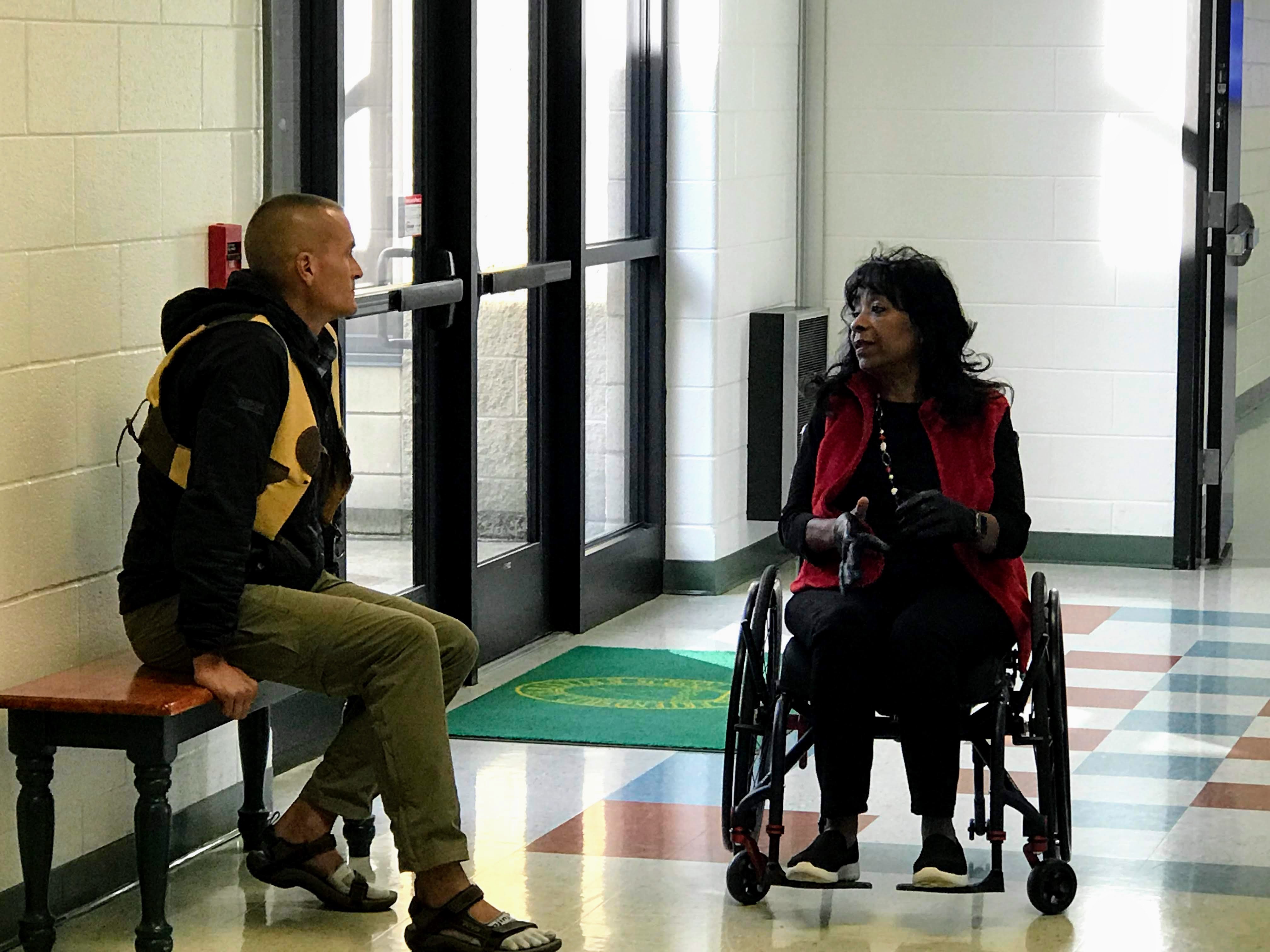 Alex’s principal talking with teacher at school