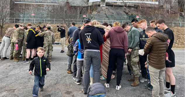 60 cadets praying