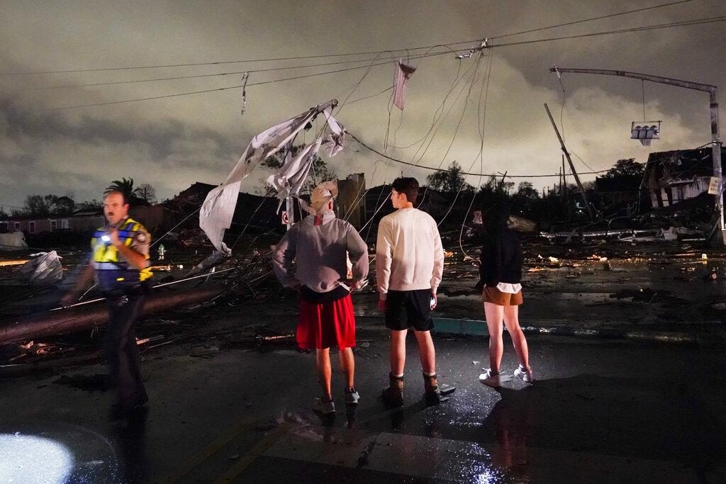 Authorities survey damage in the Lower 9th Ward in New Orleans