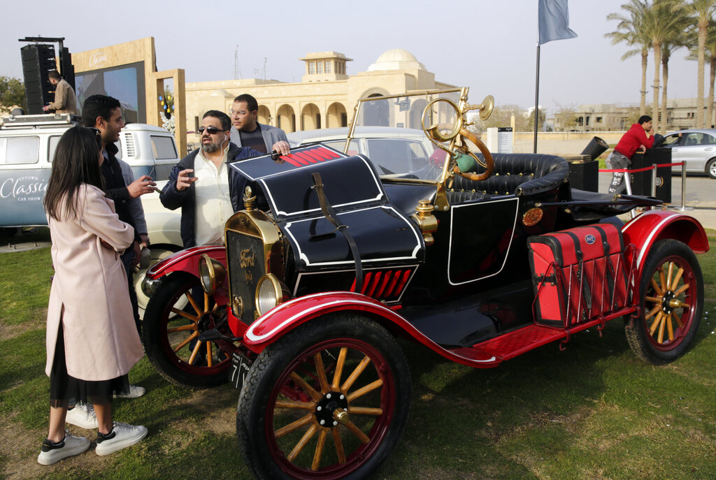 Egyptian collector Mohamed Wahdan talks to people about his 1924 Ford Model T