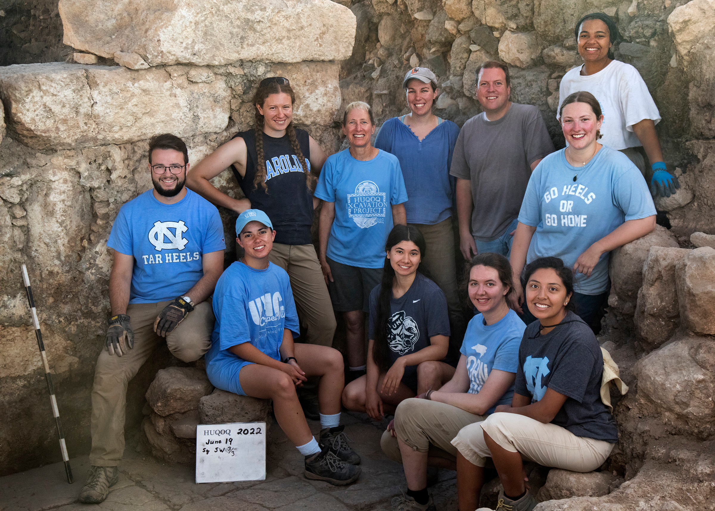 UNC-Chapel Hill participants on the Huqoq dig (including grad students and alumni). Bottom row from left to right (seated): David Richman; Christine Stamey; Aislynn Grantz; Madison Brinkley; Suzy Lagunas. Top row from left to right (standing): Emily Branton; Jodi Magness; Jocelyn Burney; Matthew Grey; Grace Curry; Jada Enoch (top right).