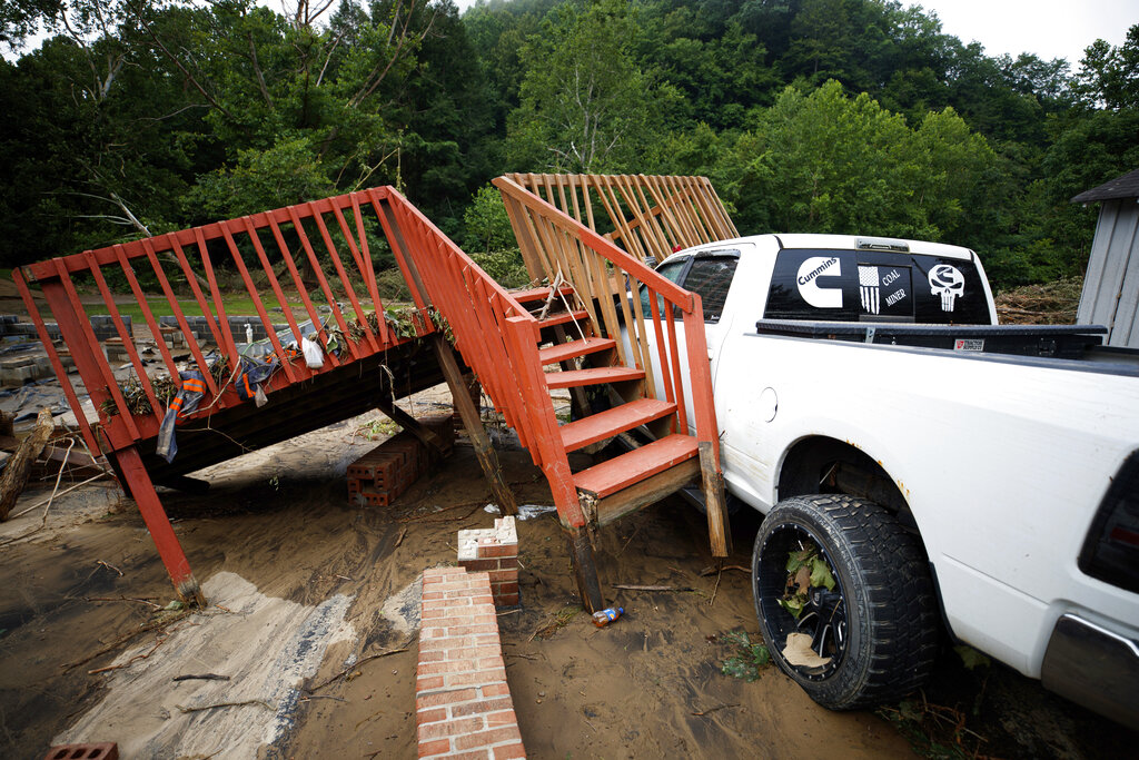 A wooden deck rests on top of a vehicle, Thursday, July 14, 2022, in Whitewood, Va.