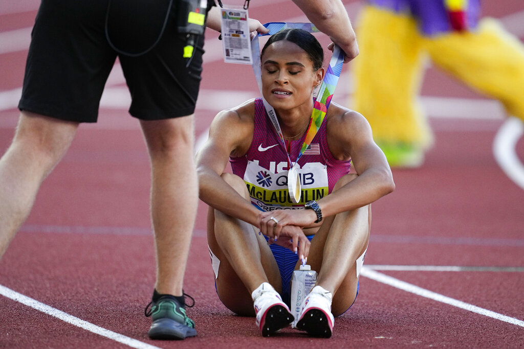 Sydney McLaughlin receives her Gold medal after the final of the women