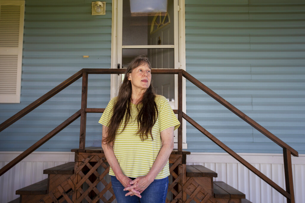 Jill Roberts in front of her home in the Ridgeview Homes mobile home community in Lockport, N.Y.