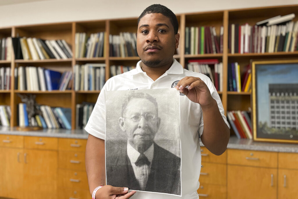 Atlanta Board of Education Community Affairs Manager Keith Glass holds an undated photograph of Luther Judson Price