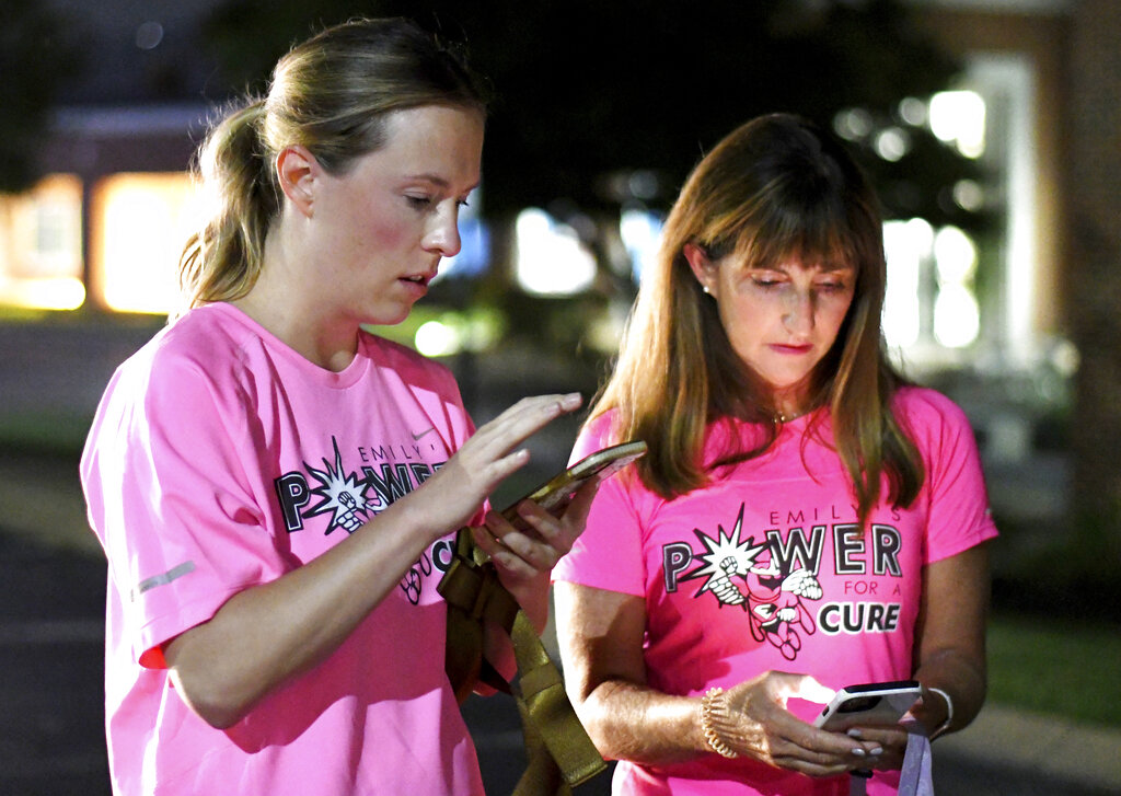 From left, event organizer Jenny Fogo and Wendy Ransom confer on the route at Girls Preparatory School, for "Finish Eliza