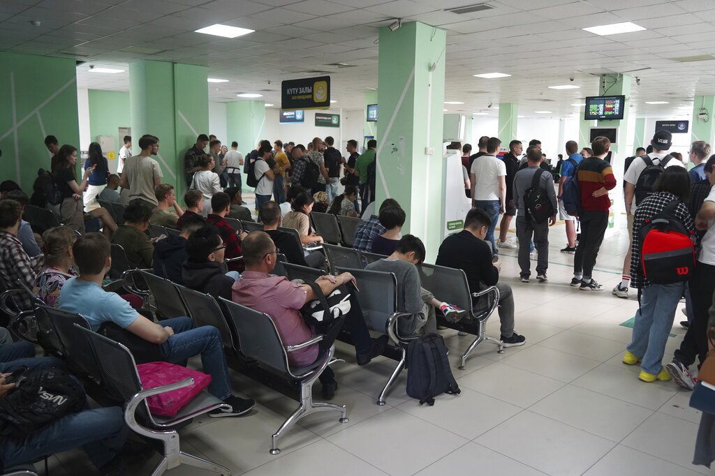 Russians wait and lineup to get Kazakhstan