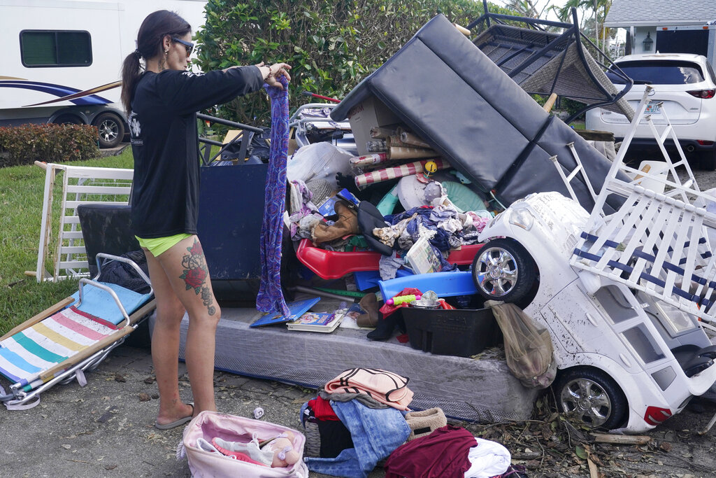 Image of woman organizing personal belongings let after Ian.