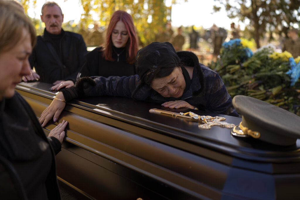 Tatiana Alexeyevna mourns over the coffin of her son Colonel Oleksiy Telizhenko during his funeral in Bucha
