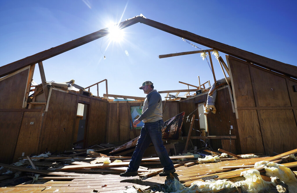 Danny Palmer, a deacon at Trinity Baptist Church, walks across the destroyed church