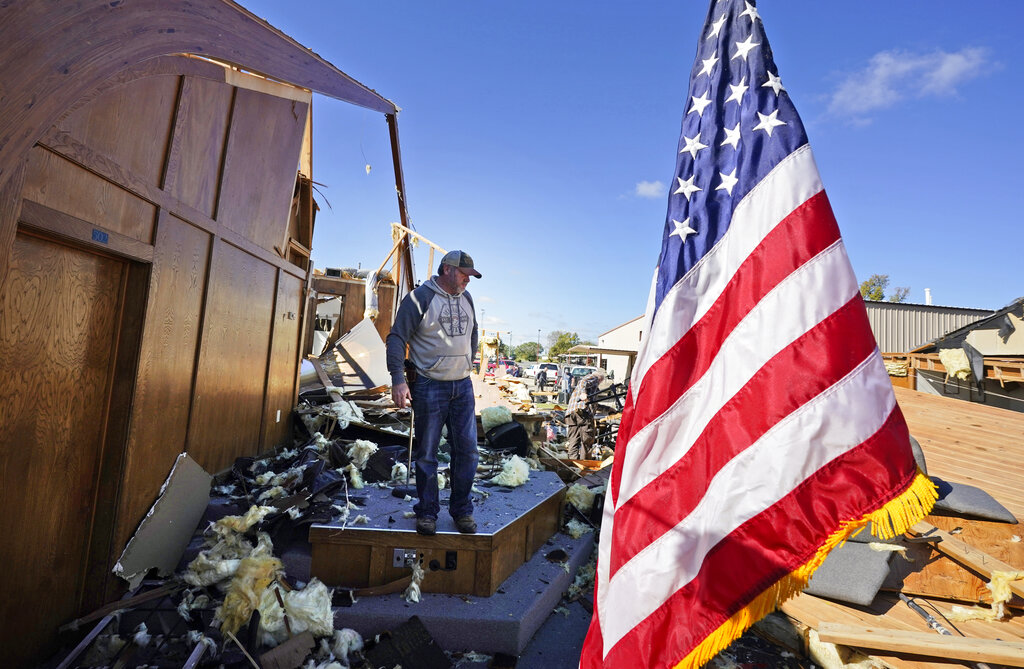 Danny Palmer, a deacon at Trinity Baptist Church, stands in the destroyed church