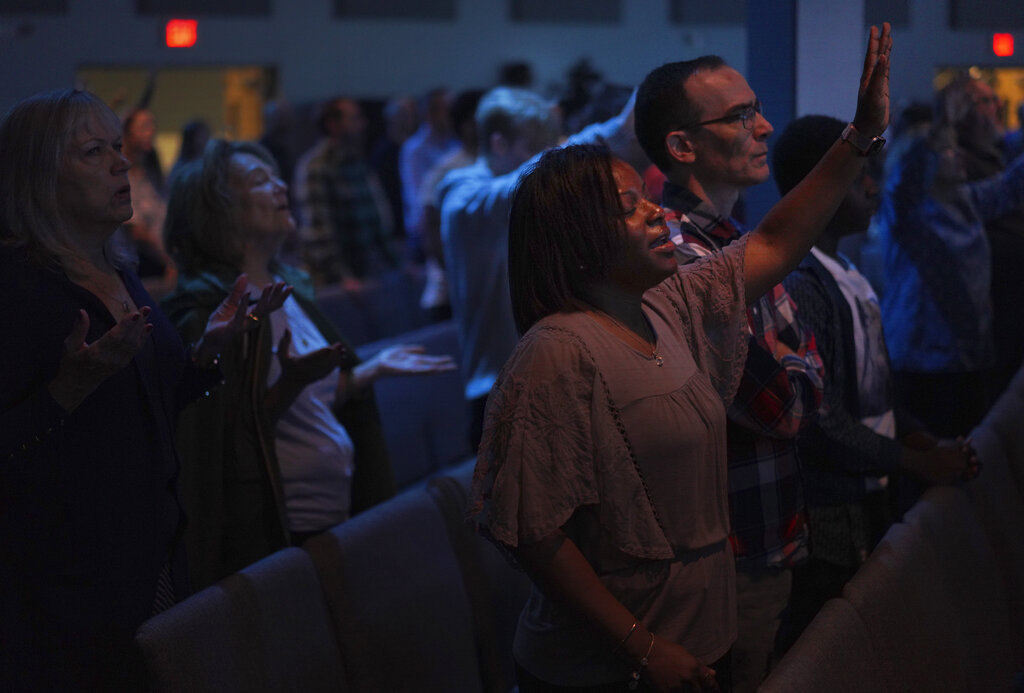 Parishioners sing during worship at Allison Park Church 