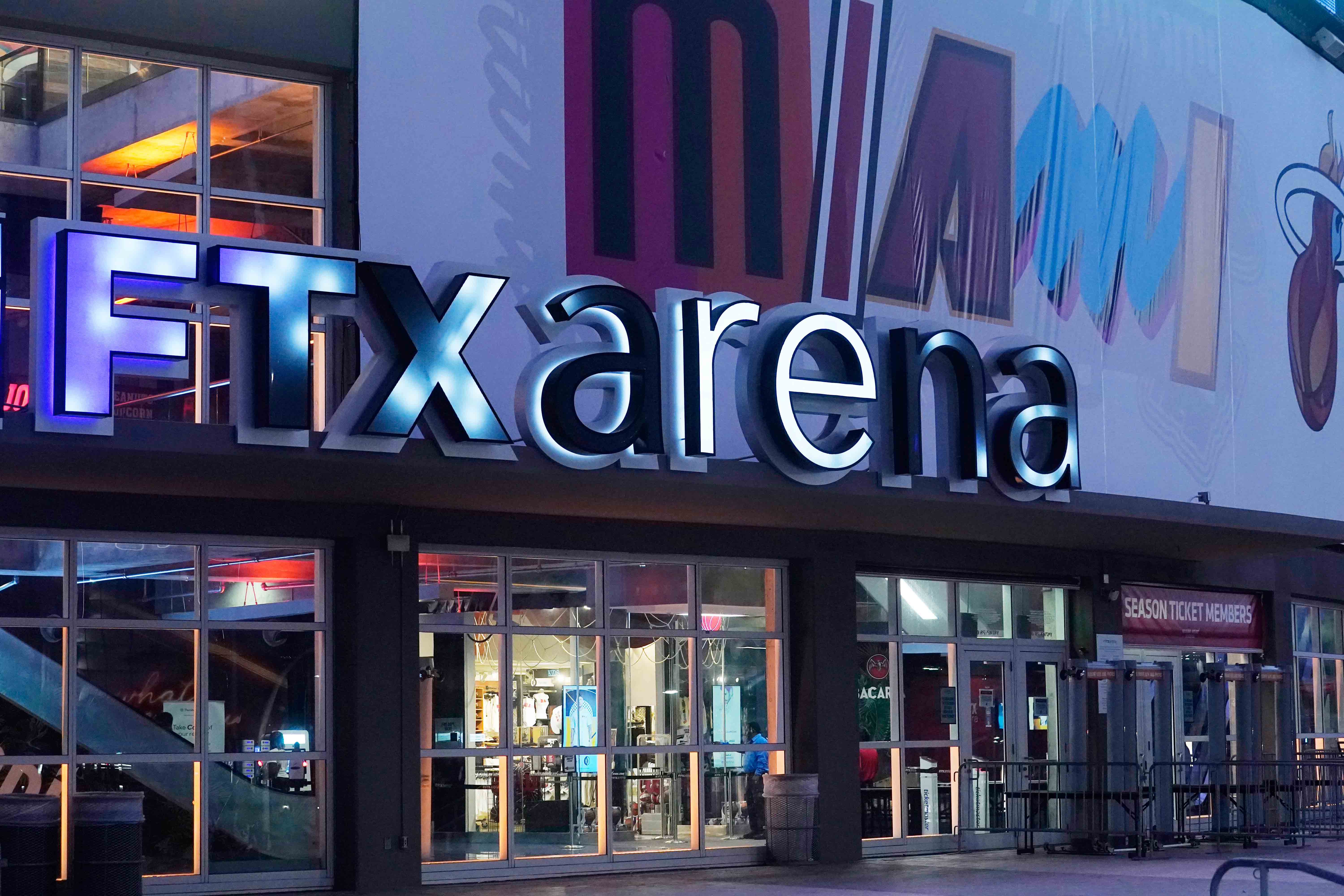 Signage for the FTX Arena, where the Miami Heat basketball team plays, is illuminated Saturday, Nov. 12, 2022, in Miami.