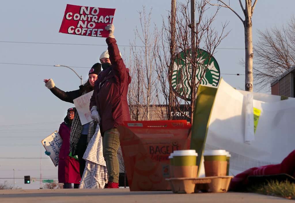 Starbucks employees work the picket line during a one-day walkout involving more than 100 stores nationwide