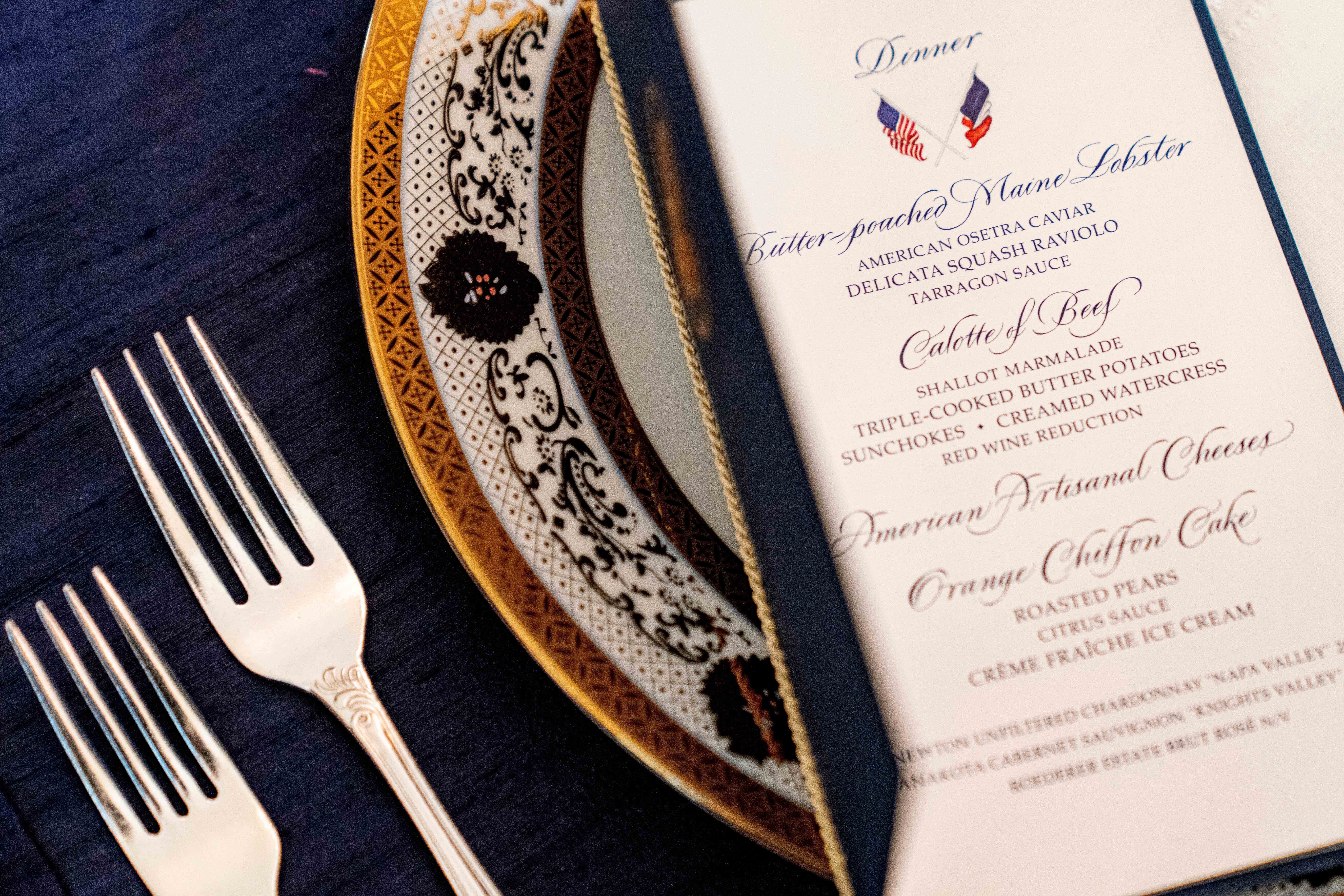 A table is set during a media preview for the State Dinner with President Joe Biden and French President Emmanuel Macron in the State Dining Room of the White House in Washington, Wednesday, Nov. 30, 2022.