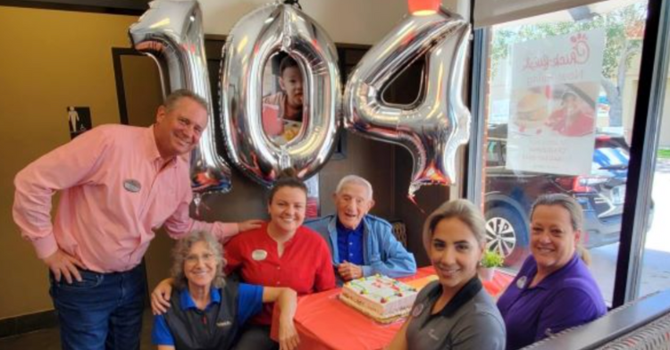 Picture of Chick-fil-A employees and 104 year-old regular