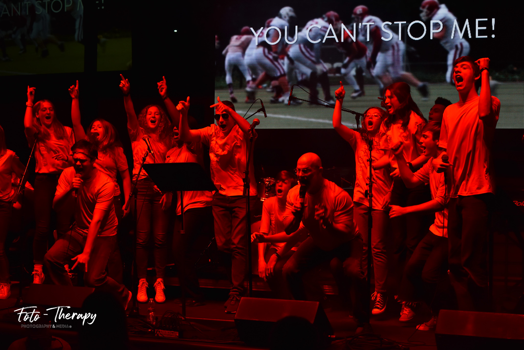 Student athletes on stage at Fields of Faith event in 2022