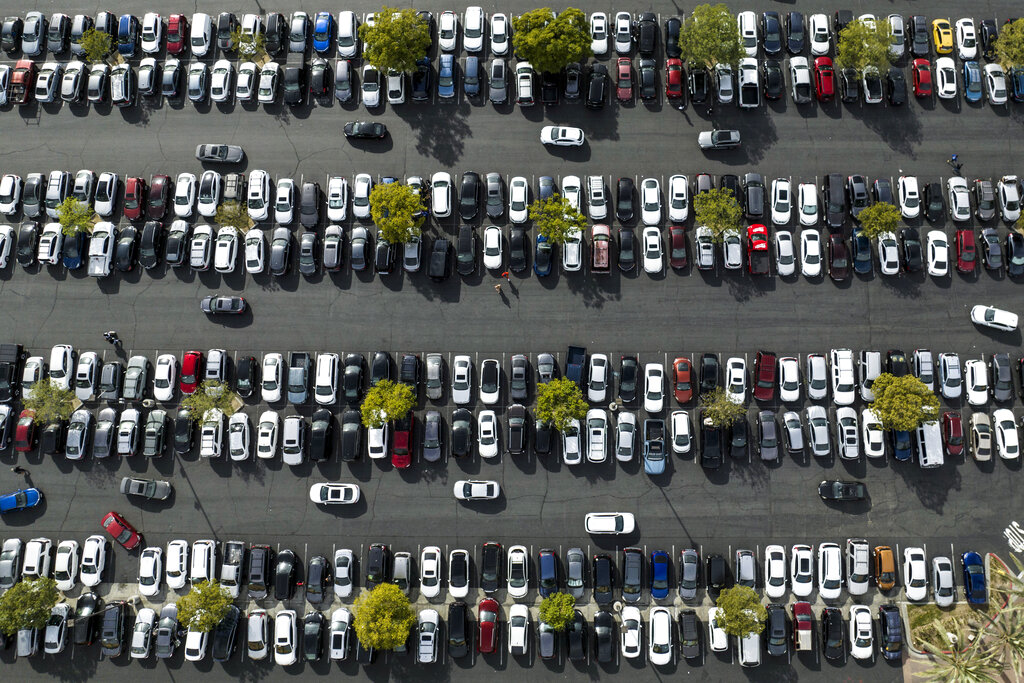 Shoppers look for an open space to park at Citadel Outlets in Commerce, Calif.