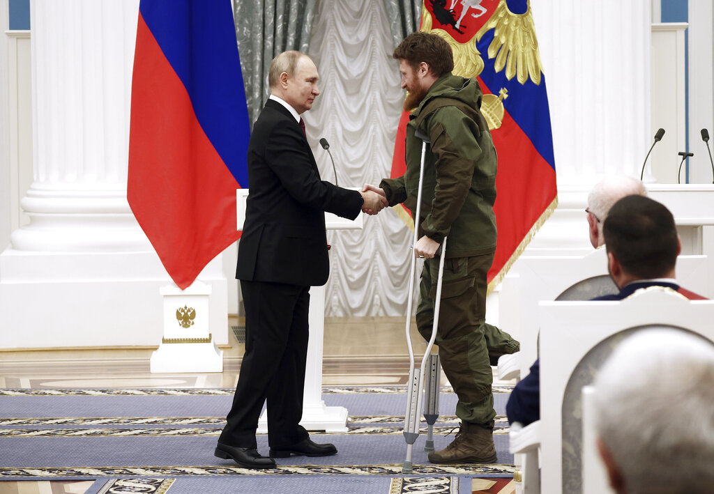 Russian President Vladimir Putin awards founder of the WarGonzo media project Semyon Pegov with the Order of Courage during an awarding ceremony at the Kremlin