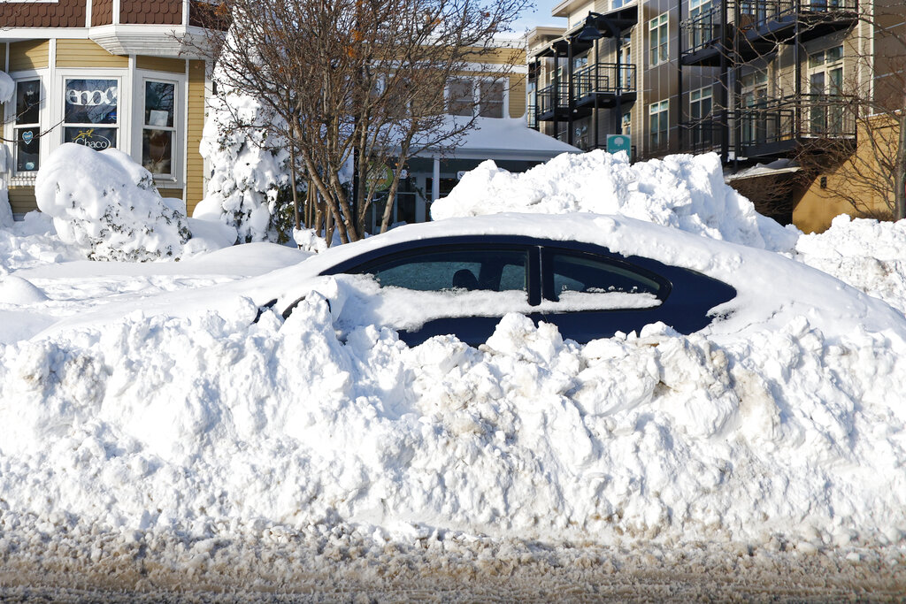 A car sits buried under snow in Buffalo, NY