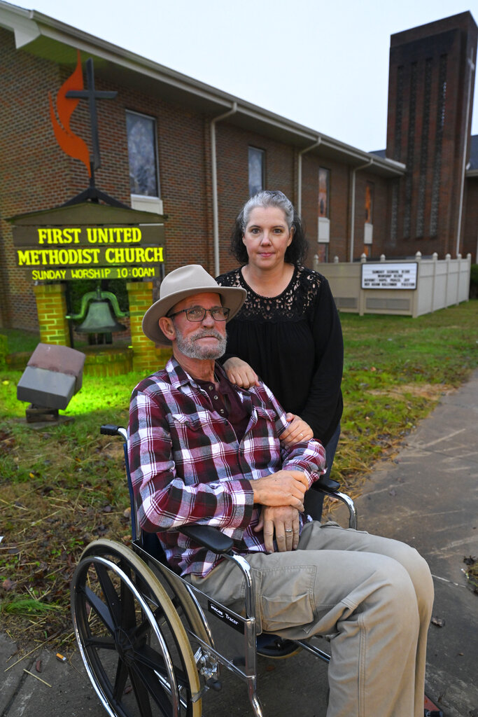 Jerry Lamb, who has a spine condition, poses with wife, Laura, in front of Camden First United Methodist Church
