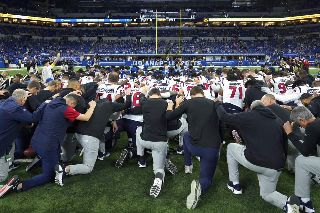 The Houston Texans and Indianapolis Colts gather on the field before their NFL football game in support of Buffalo Bills safety Damar Hamlin