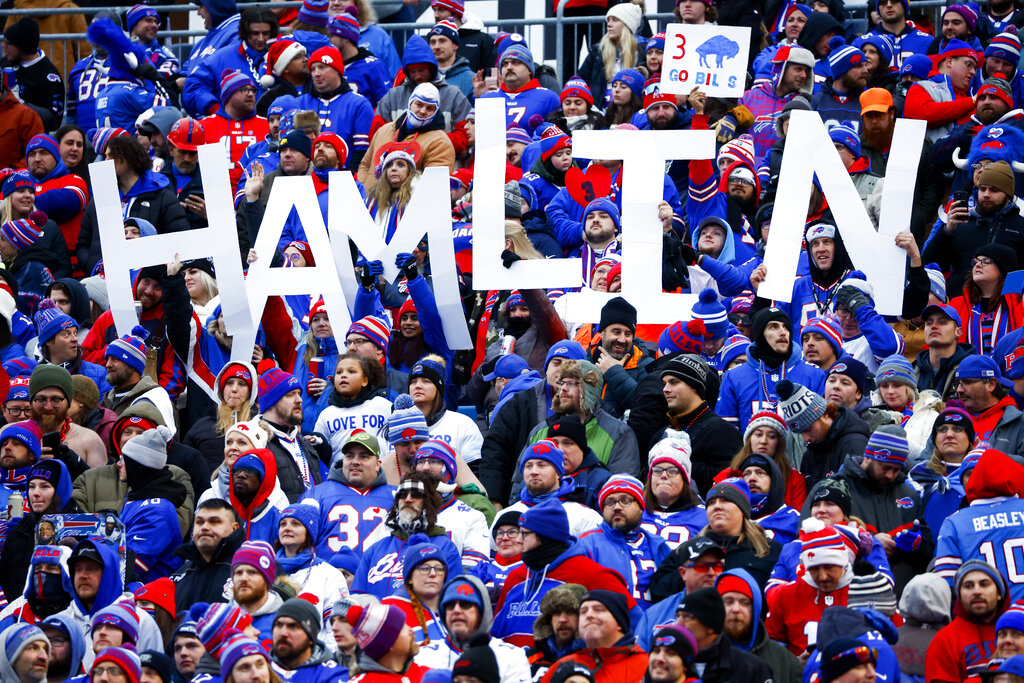 Fans hold a sign in support of Buffalo Bills safety Damar Hamlin during the second half of an NFL football game against the New England Patriots, Sunday, Jan. 8, 2023